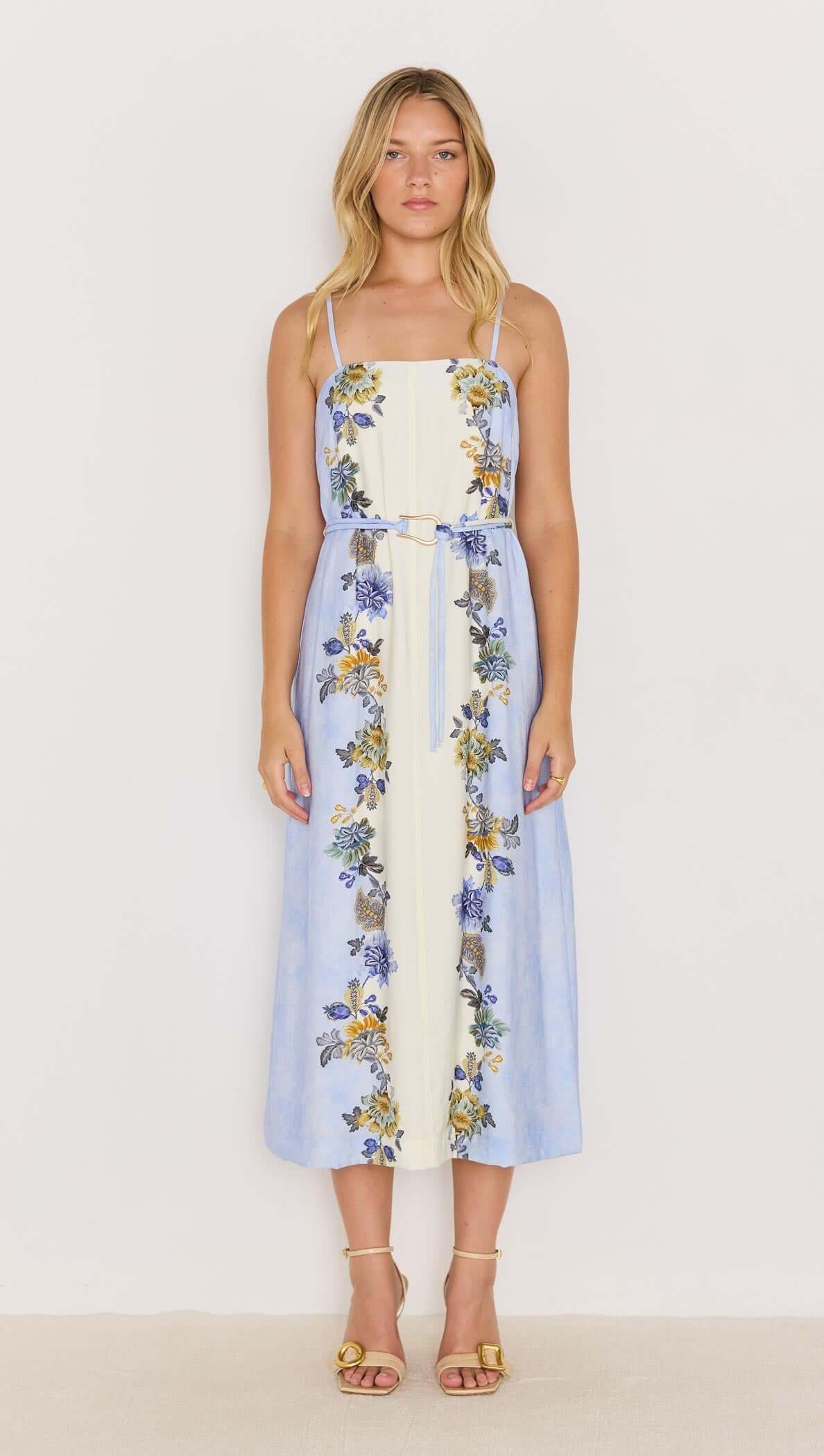 Lucia blue floral midi dress with tie waist, featuring spaghetti straps and a flowing skirt, perfect for warm weather.