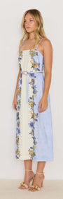 Lucia blue floral midi dress with tie waist, featuring slim straps and vibrant floral prints, perfect for summer occasions.