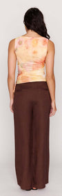 Back view of a model wearing the Sunset Tonal Drawstring Mesh Top with adjustable side drawstrings.