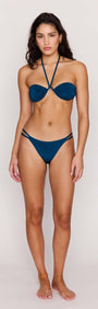 Teal Halter-Neck Bikini Top worn by a model, featuring soft ruching and adjustable straps for a secure fit.