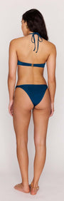 Back view of a woman wearing a Teal Halter-Neck Bikini Top with adjustable straps and bikini bottoms.