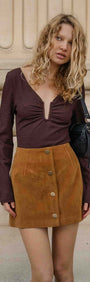 Model wearing U Wire Textured Jersey Top in Chocolate with a suede skirt, showcasing a stylish and trendy outfit.