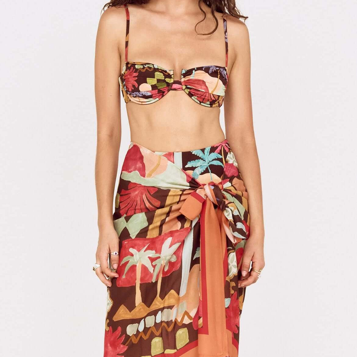 Model wearing Vinatage Coastal Print Long Sarong with tropical design, perfect for resort styling.
