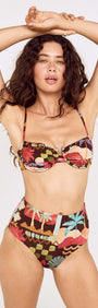 Vintage Coastal Print Gathered Bikini Top model wearing vibrant tropical floral swimwear in a chic pose.
