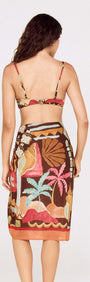 Back view of a model wearing a Vintage Coastal Print Gathered Bikini Top paired with a colorful wrap skirt.