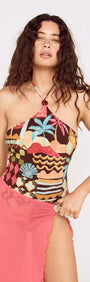 Model wearing a Vintage Coastal Print Halterneck One Piece swimsuit, showcasing vibrant colors and patterns.