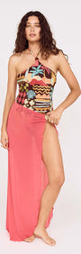 Model wearing a Vintage Coastal Print Halterneck One Piece paired with a flowing coral cover-up.