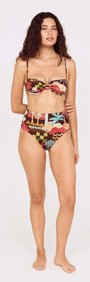 Model wearing a Vintage Coastal Print High Waisted Bikini Bottom paired with a matching top, showcasing vibrant tropical patterns.