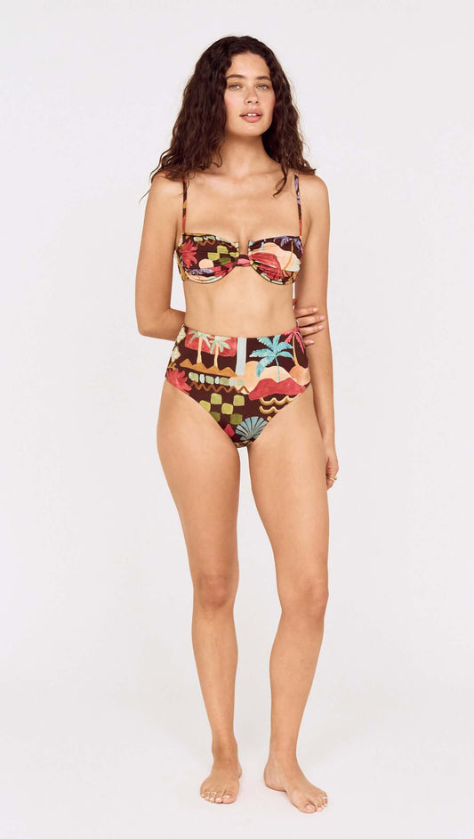 Model wearing a Vintage Coastal Print High Waisted Bikini Bottom paired with a matching top, showcasing vibrant tropical patterns.