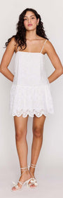 Model wearing a White Broderie Anglaise Mini Dress with scalloped edges and a relaxed fit.