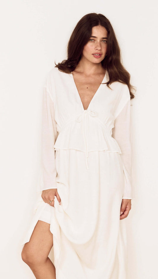 Woman wearing a White Crinkle Tie Front Midi Dress with a soft V-neckline and relaxed long sleeves.