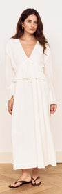 Model showcasing the White Crinkle Tie Front Midi Dress with relaxed fit and soft V-neckline.