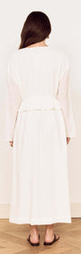 Back view of a woman wearing a White Crinkle Tie Front Midi Dress with flowing fabric and relaxed fit.