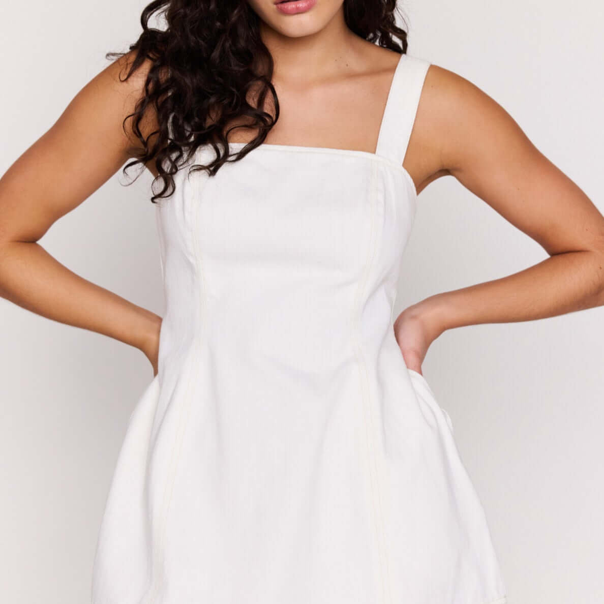White Denim Square Neck Mini Dress on a model showcasing its structured design and square neckline.