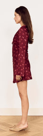 Wine Satin Paisley Knot Front Bias Mini Dress showcased from the side, featuring flared sleeves and a rich paisley print.
