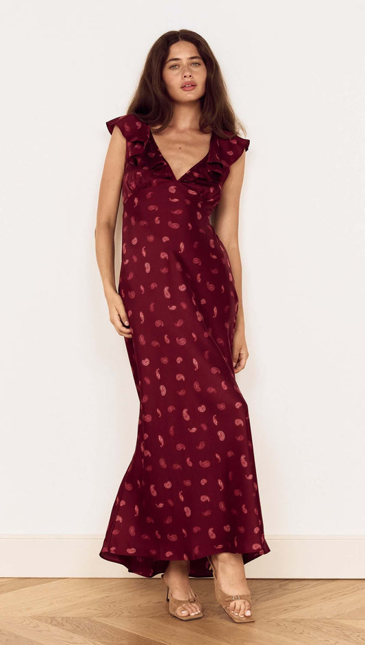 Wine Satin Paisley Ruffled Bias Midi Dress showcasing elegant ruffles and a plunging neckline in a beautiful wine hue.