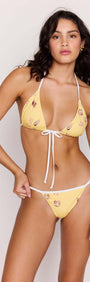 Yellow Printed Cheeky Strappy Bikini Bottoms worn with a matching triangle top, showcasing a summer-ready look.