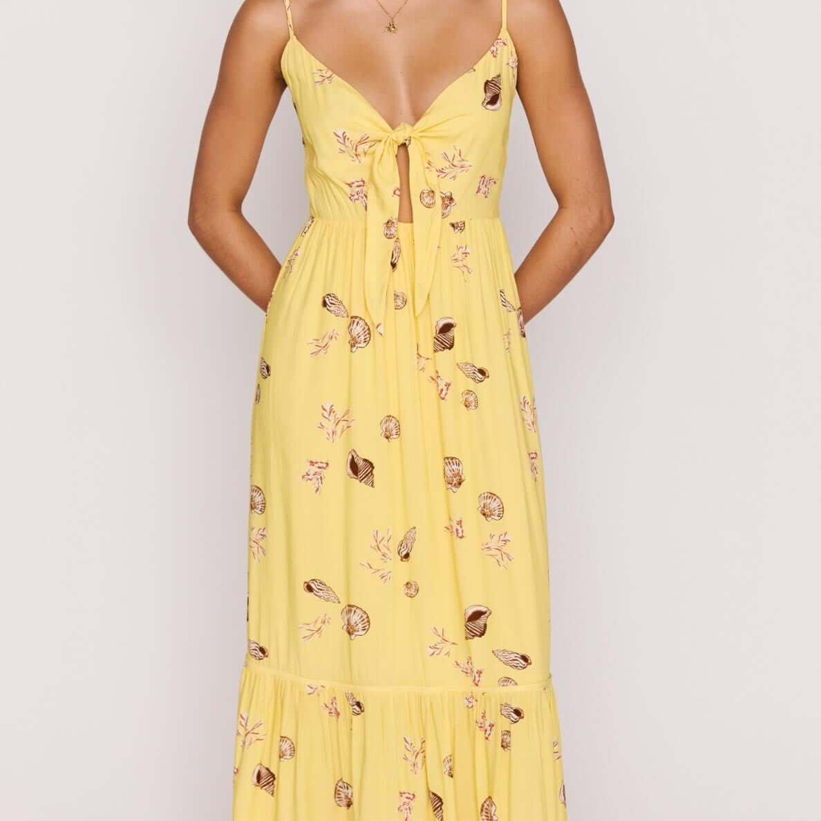 Yellow Printed ECOVERO Summer Midi Dress featuring a front tie, V-neckline, and a flowing skirt in a seashell print.