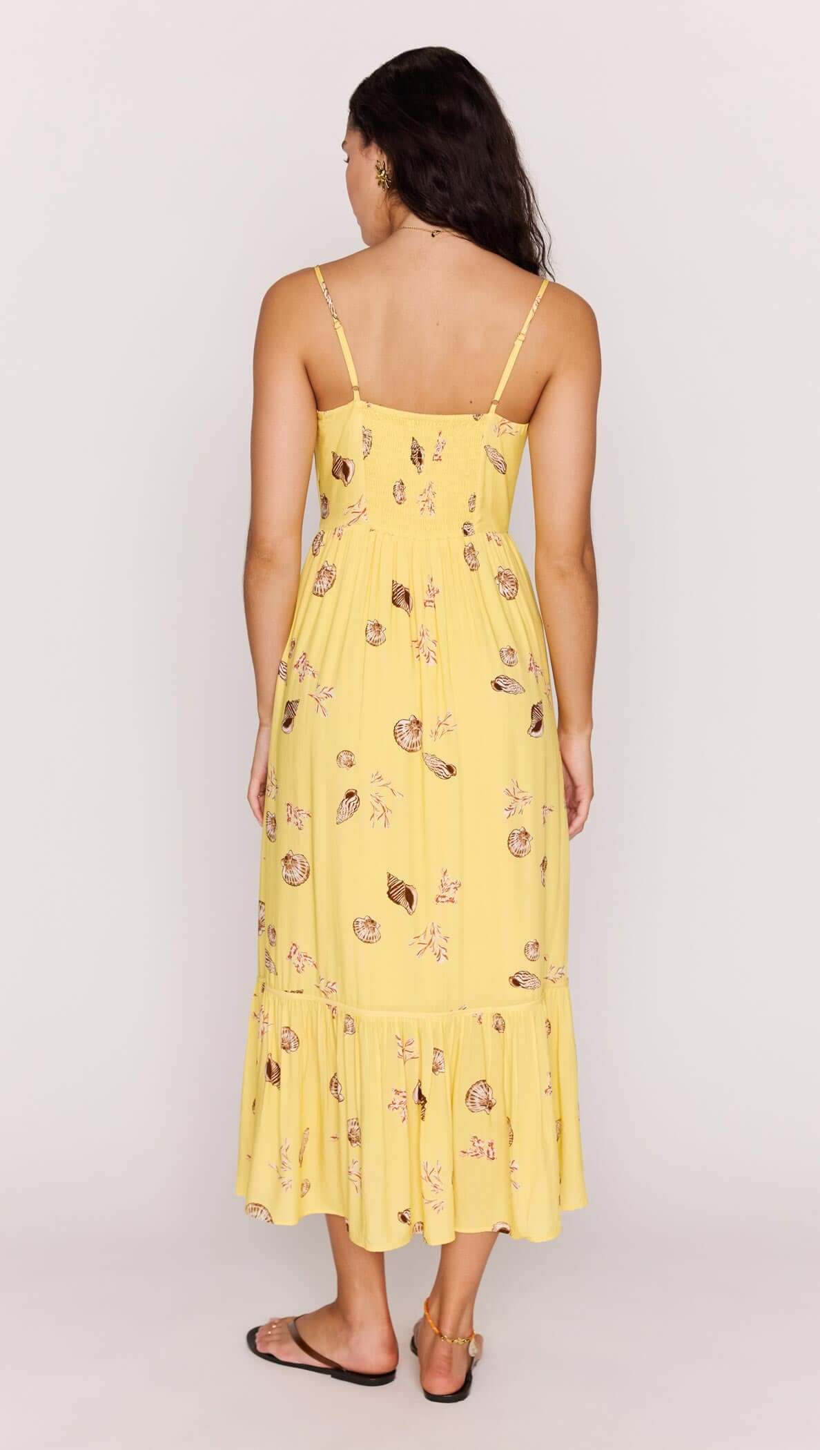 Yellow Printed ECOVERO Summer Midi Dress showing the back view with seashell print and flowy skirt.