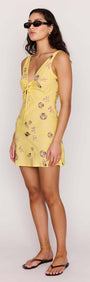 Yellow Printed ECOVERO Summer Mini Dress on a model, featuring a flattering V-neckline and seashell print, perfect for summer.