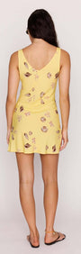 Yellow Printed ECOVERO Summer Mini Dress showcasing a flattering V-neckline and seashell print from the back.