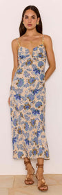 Linen Blend Blue Floral Bias Midi Dress worn by a model, featuring a soft sweetheart neckline and adjustable straps.