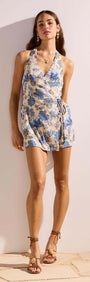 Linen Blend Blue Floral Halter Playsuit worn by a model, showcasing its vintage floral print and flattering fit.