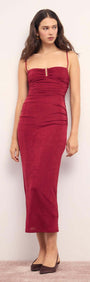 Elegant model wearing a Red Slinky Midi Dress featuring spaghetti straps and ruched details.
