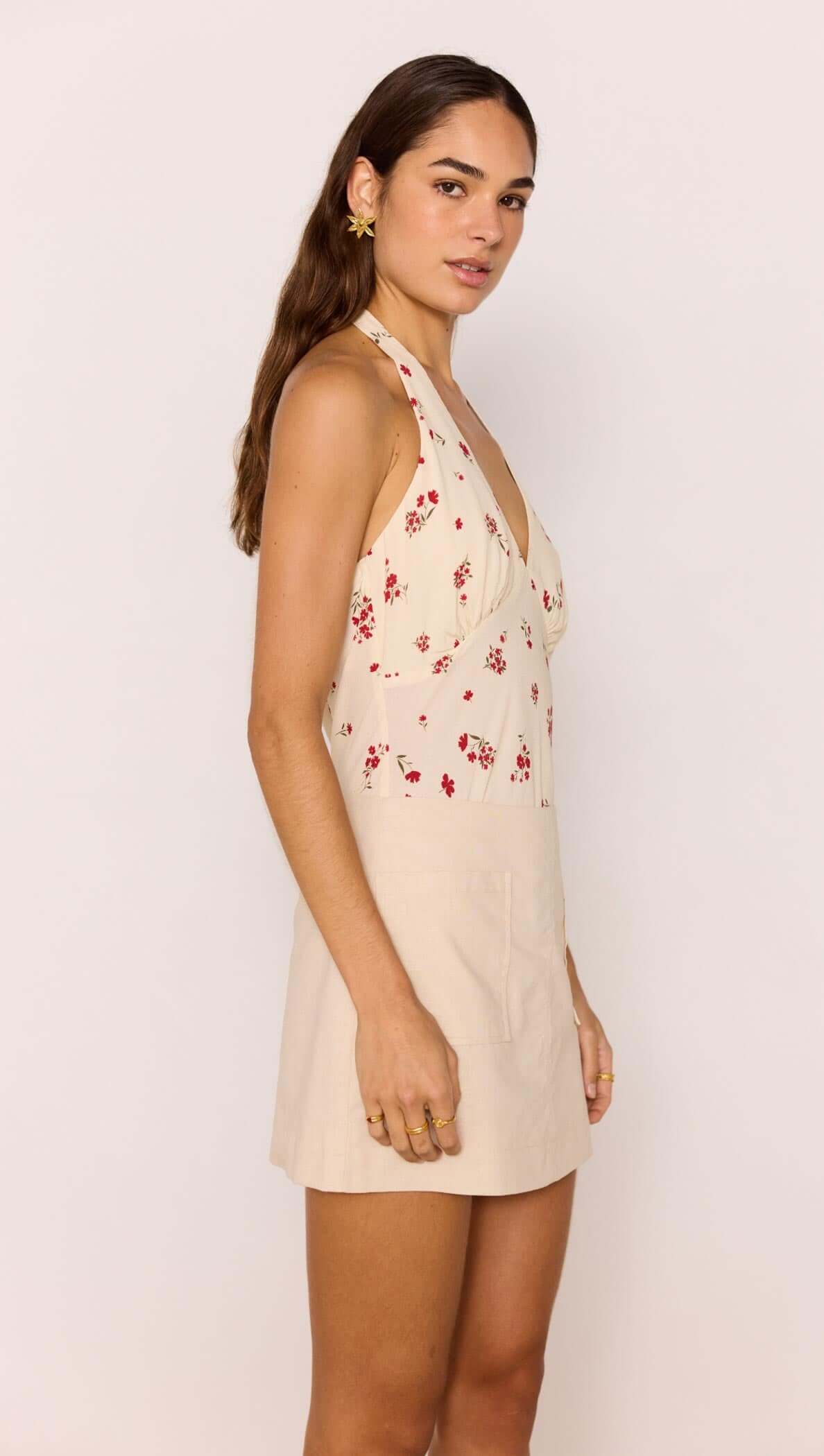 Beige A-Line Cotton/Linen Blend Mini Skirt displayed on a model, showcasing its floral design and flattering silhouette.