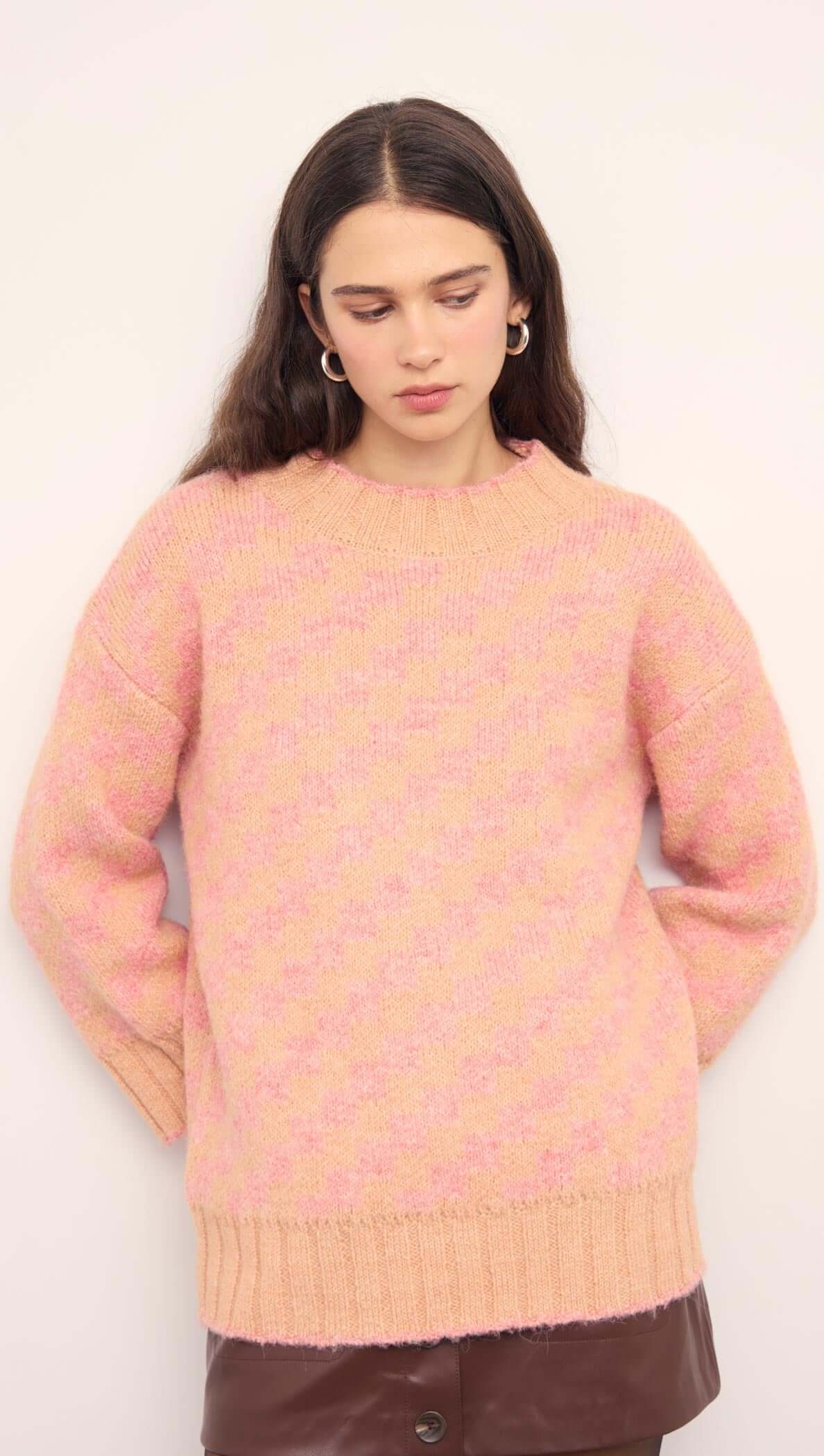 Pink Contrast Chunky Knit Jumper on a model, showcasing relaxed fit and soft peach color.