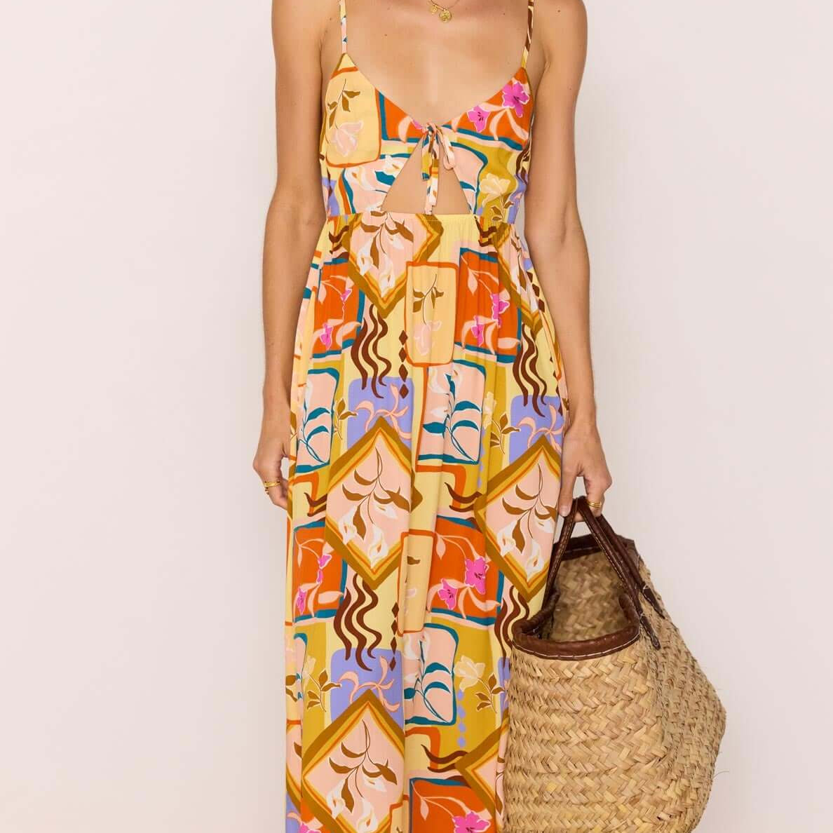 Bold Scarf Print Midi Dress With Cut Out worn by a model, featuring a vibrant abstract print and relaxed fit.