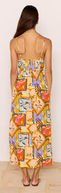 Back view of the Bold Scarf Print Midi Dress With Cut Out, showcasing vibrant abstract print and adjustable straps.