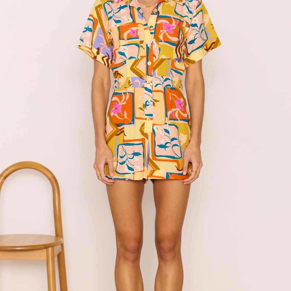 Bold Scarf Print Playsuit worn by a model, showcasing vibrant geometric floral design and relaxed fit.