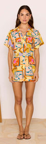 Bold Scarf Print Playsuit worn by a model, showcasing vibrant geometric floral design and relaxed fit.