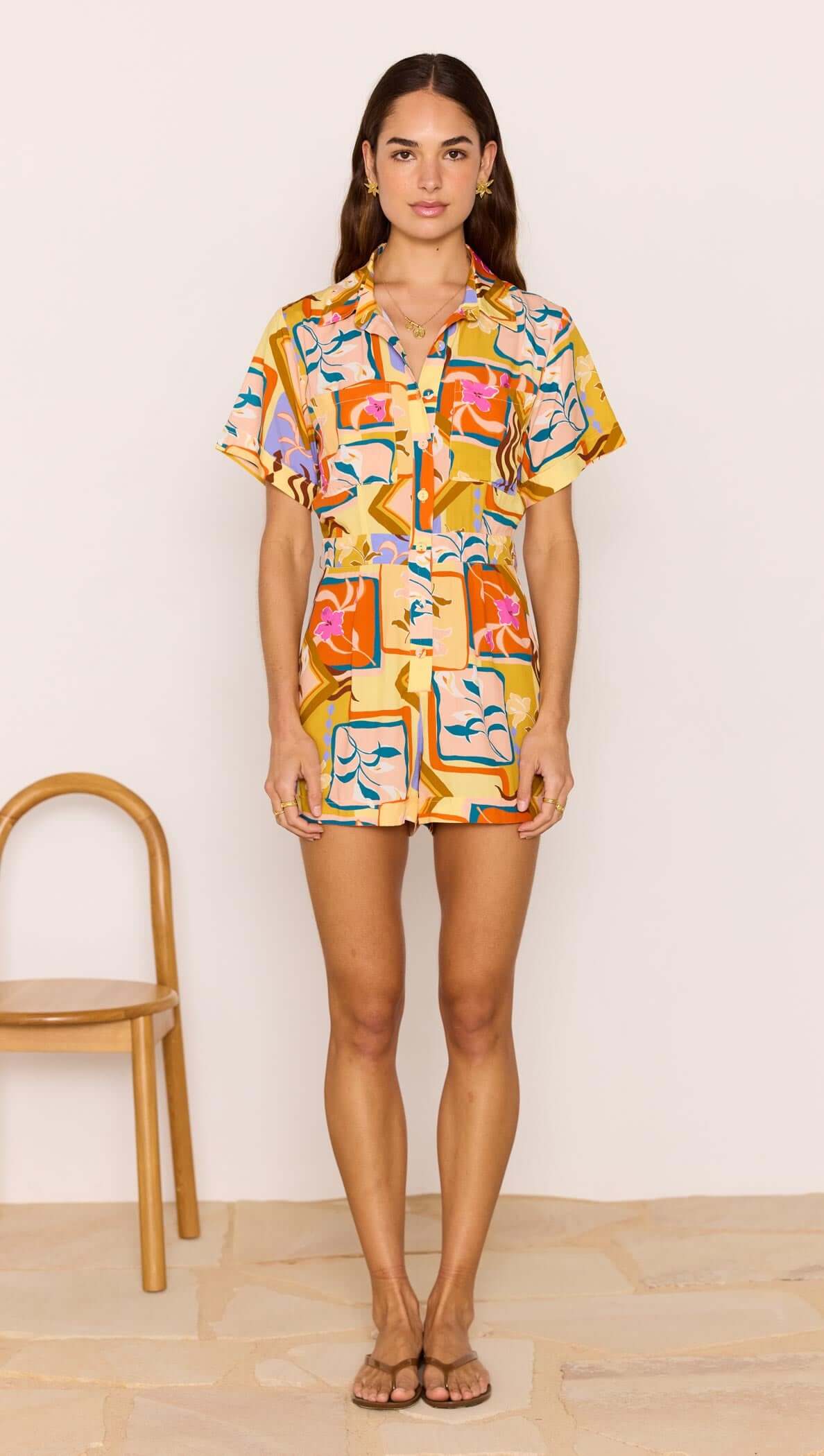 Bold Scarf Print Playsuit worn by a model, showcasing vibrant geometric floral design and relaxed fit.