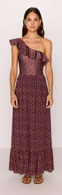 Model wearing a burgundy floral print ruffle hem maxi skirt, showcasing a stylish, one-shoulder design.