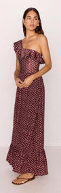 Sierra Ruffle Hem Maxi Skirt in Burgundy Floral Print showcased on a model, highlighting its stylish design.