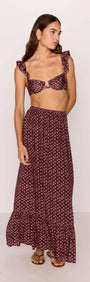 Model wearing a ruffle hem maxi skirt in burgundy floral print paired with matching crop top, perfect for summer outfits.