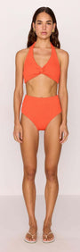 Scarlett Halter Neck Bikini Top displayed in bold poppy red, featuring a twist-front design with high-waisted bottoms.