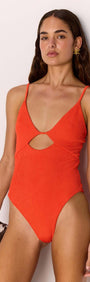 Scarlett Red Cut-Out Swimsuit on model showcasing flattering V-neckline and cut-out design.