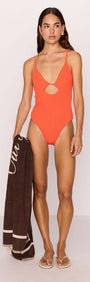Scarlett Red Cut-Out Swimsuit worn by a model, featuring a V-neckline and cut-out detail, perfect for summer.