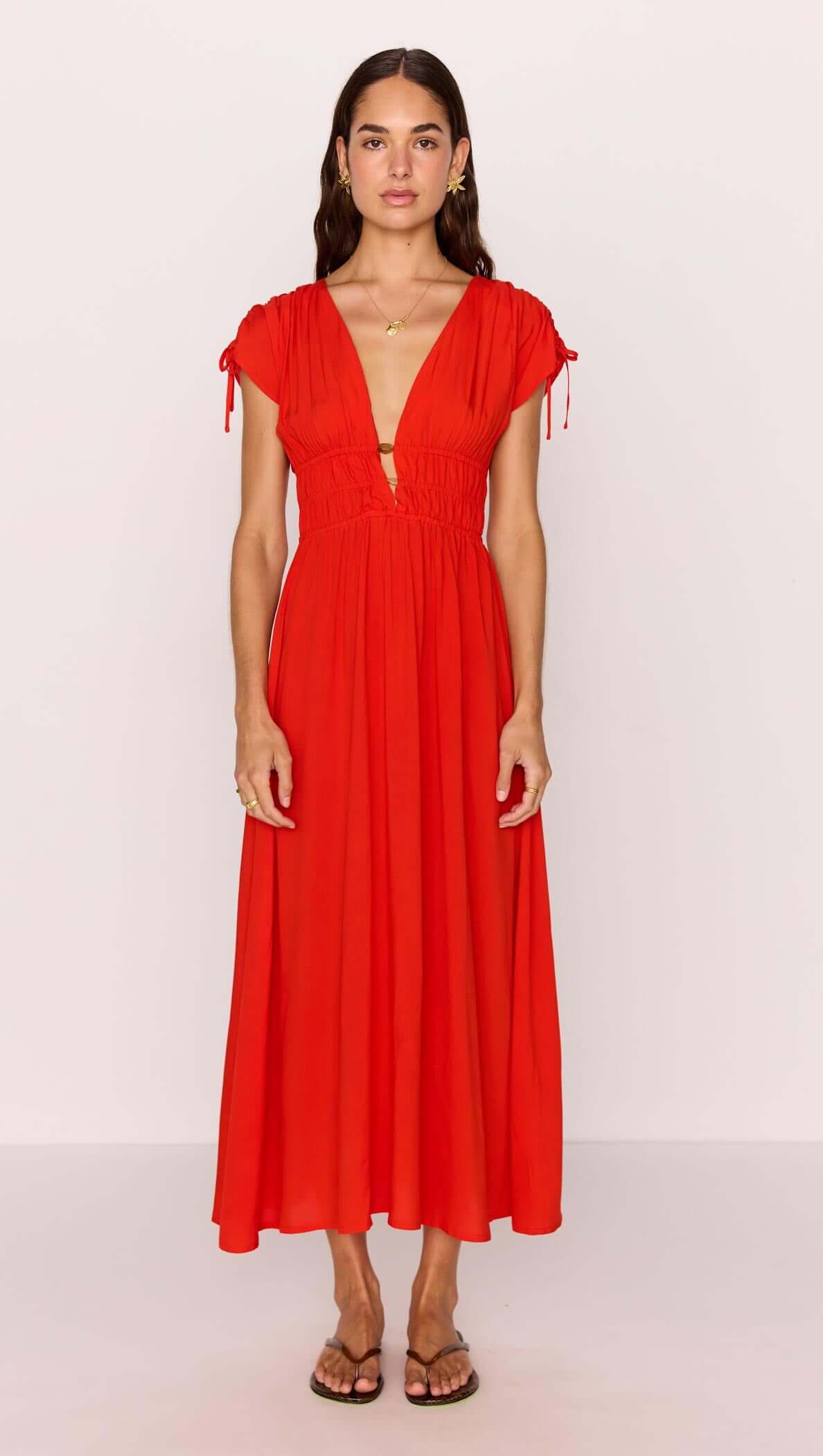 Scarlett V-Neck Midi Dress with Bead Detail in vibrant poppy red, featuring a plunging neckline and soft cap sleeves.