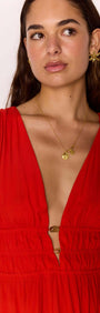 Scarlett V-Neck Midi Dress with Bead Detail on model showcasing the plunging neckline and tie detailing.