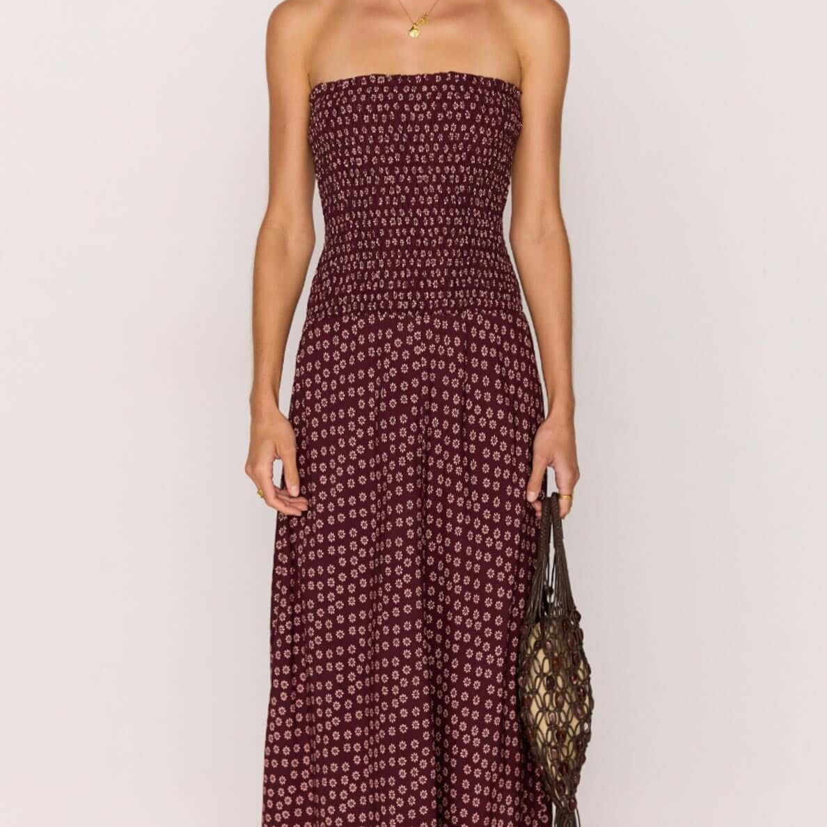 Burgundy floral print maxi dress with a strapless ruched bodice, perfect for summer outings and casual occasions.