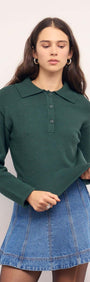 Model wearing a Teal Green Knit Polo Sweater with structured collar and button-up neckline, paired with a denim mini skirt.