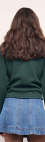 Teal Green Knit Polo Sweater showcased with a denim mini skirt from the back, emphasizing casual chic style.