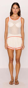 Model wearing White Cotton Knit Shorts with Scallop Contrast Edge, showcasing a stylish summer look.