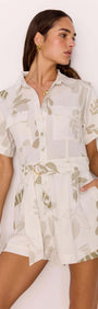 Model showcasing the White & Sage Leaf Print Playsuit with a collared neckline and matching fabric belt.