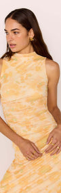 Yellow Floral Mesh Midi Dress featuring a sleeveless design and orange watercolor floral print on a model.