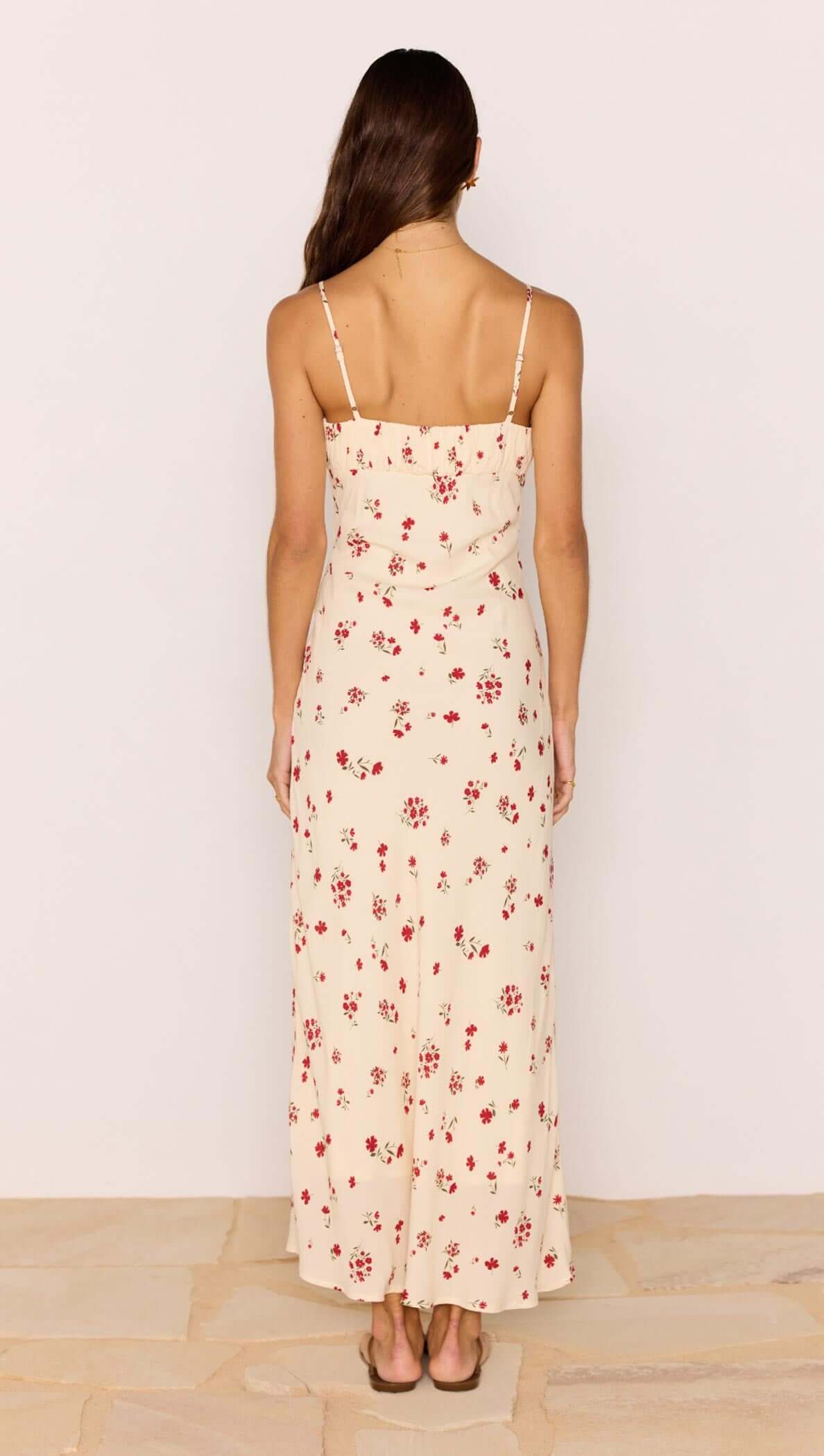 Back view of the Red &amp; Cream Floral Bias Midi Dress showcasing its spaghetti straps and subtle floral print.